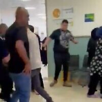 Family members and security guards clash at the Galilee Medical Center on May 18, 2022 (Screencapture/Channel 12)