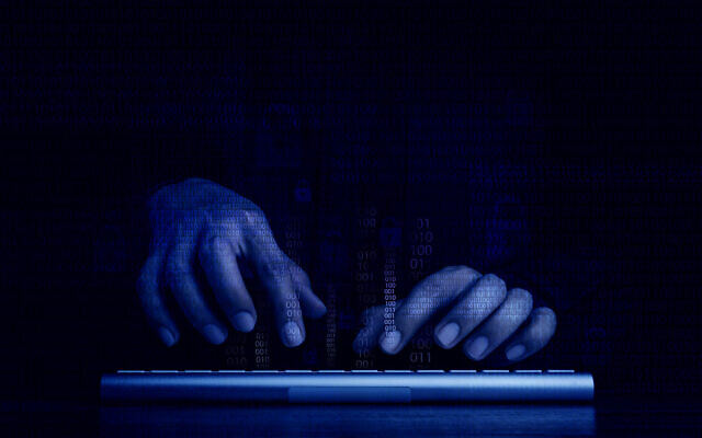 An illustrative photo of a person typing on a keyboard as part of a cyber breach. (Techa Tungateja; iStock by Getty Images)