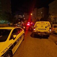 The scene in Kiryat Ata where a 62-year-old woman was found stabbed to death in the stairwell of a residential building, May 7, 2022. (Magen David Adom)