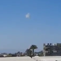 A cloud of smoke is seen over the Gaza Strip, after the Iron Dome intercepted a drone, May 19, 2022 (screenshot: Twitter)