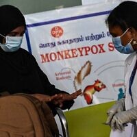 Health workers screen passengers arriving from abroad for monkeypox symptoms at Anna International Airport terminal in Chennai, India, June 3, 2022. (Arun SANKAR / AFP)
