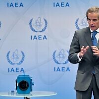 Rafael Grossi, director general of the International Atomic Energy Agency (IAEA), updates journalists about the current situation in Iran as he stands next to an example of a monitoring camera, at the agency's headquarters in Vienna, Austria on June 9, 2022. (JOE KLAMAR / AFP)