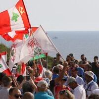Lebanese protesters take part in a demonstration at the Lebanese southernmost border area of Naqura, on June 11, 2022, days after Israel moved a gas production vessel into an offshore field, a part of which is claimed by Lebanon. (Mahmoud ZAYYAT / AFP)