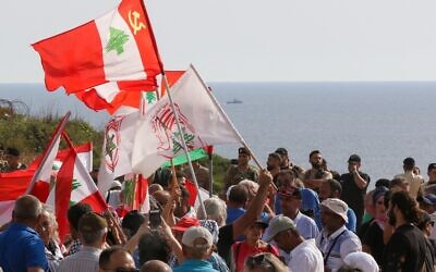 Lebanese protesters take part in a demonstration at the Lebanese southernmost border area of Naqura, on June 11, 2022, days after Israel moved a gas production vessel into an offshore field, a part of which is claimed by Lebanon. (Mahmoud ZAYYAT / AFP)
