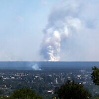 A picture taken on June 21, 2022, from the town of Lysychansk shows a large plume of smoke rising on the horizon behind the town of Severodonetsk, amid the Russian invasion of Ukraine. (Anatolii Stepanov/AFP)