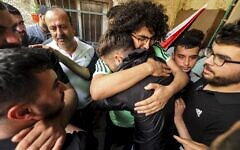 Relatives mourn during the funeral of Palestinian Ali Harb, who Palestinians say was killed by an Israeli settler in the northern West Bank village of Iskaka on June 22, 2022 (Photo by JAAFAR ASHTIYEH / AFP)