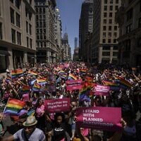 Participants march during the 2022 New York Pride Parade in New York City on June 26, 2022. (Ed JONES / AFP)