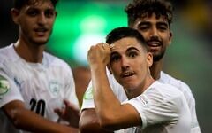 Israel's midfielder Oscar Gloukh celebrates scoring the opening goal with his teammates during the UEFA Under-19 European Championship semi-final football match between France and Irsael at the DAC Arena in Dunajska Streda, Slovakia on June 28, 2022. (VLADIMIR SIMICEK / AFP)