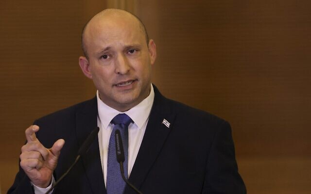 Outgoing Prime Minister Naftali Bennett announces he won't run in the next elections, at a press conference in the Knesset, June 29, 2022. (AHMAD GHARABLI / AFP)