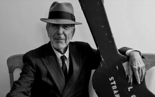 Leonard Cohen with his guitar ready to go out on tour, circa the late-2000s. (Courtesy of the Cohen Estate)