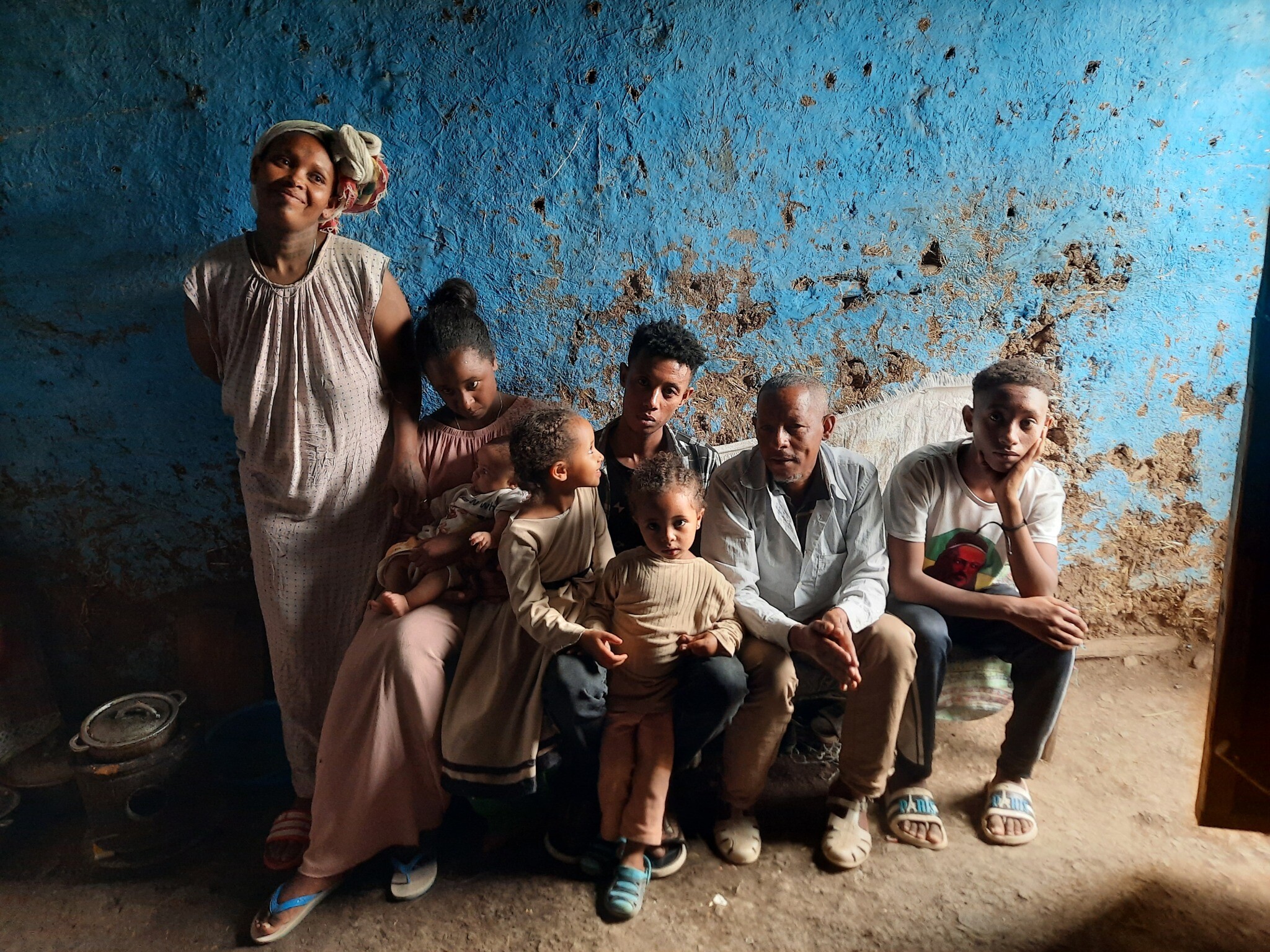 Kefale Tayachew, his wife, Addisie, and their six children (from left) Alemnesh, Abraham, Lemlem, Desalegn, Elssa and Muluken, in their home in Gondar on May 29, 2022. (Amy Spiro/Times of Israel)