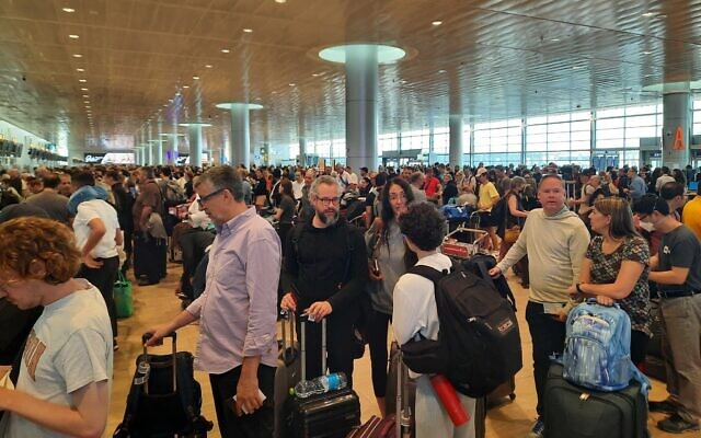 Lines for check-in at Ben Gurion Airport, June 26, 2022 (Amy Spiro/Times of Israel)