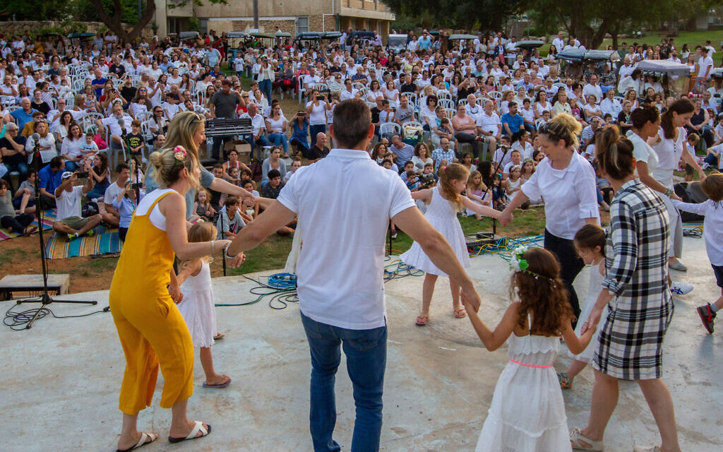 Israelis seen at a Shavuot celebration in Kibbutz Ga'ash on June 8, 2019. (Flash90/via JTA)
