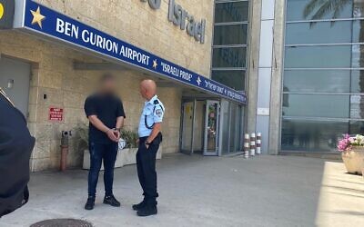 A man heading to his honeymoon is arrested at Ben Gurion Airport on suspcicion he supplied a gun that was used to fire in the air at his wedding, March 30, 2022. (Israel Police)