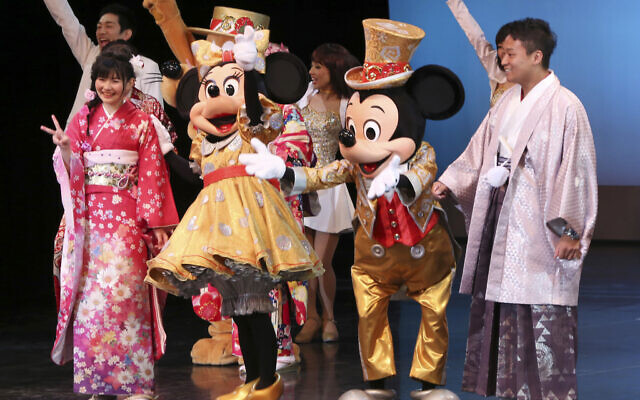 Illustrative: Japanese young adults celebrate turning 20 years old, clad in Japanese kimono, together with Mickey Mouse and Minnie Mouse and other Disney characters on stage during a coming of age ceremony at Tokyo Disneyland on the national holiday Coming of Age Day, January 9, 2017. (AP Photo/Koji Sasahara)