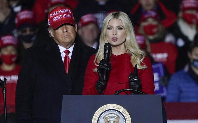 In this Nov. 2, 2020 file photo, Ivanka Trump speaks at a campaign event while her father, President Donald Trump, watches in Kenosha, Wis.  (AP Photo/Morry Gash, File)