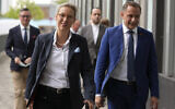 Newly elected leaders of Germany's Alternative for Germany (AfD) party Alice Weidel, left and Tino Chrupalla arrive for a press conference in Berlin, Germany, September 27, 2021. (AP Photo/Matthias Schrader)