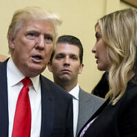 Donald Trump, left, Donald Trump Jr., center, and his daughter Ivanka Trump speak during the unveiling of the design for the Trump International Hotel in the The Old Post Office in Washington, on Sept. 10, 2013. In papers filed Monday, March 21, 2022, in a state appeals court, former President Trump's lawyers say a New York judge abused his discretion with a decision in February requiring the former president to answer questions under oath in a civil investigation into his business practices. (AP Photo/Manuel Balce Ceneta, File)