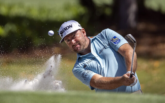 Graeme McDowell, of Northern Ireland, hits out of a bunker on the seventh hole during the second round of the RBC Heritage golf tournament on Hilton Head Island, South Carolina, April 15, 2022. (AP/Stephen B. Morton)