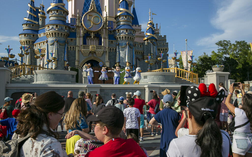 Illustrative: Performers dressed as Mickey Mouse, Minnie Mouse, Goofy, Donald Duck and Daisy Duck entertain visitors at Cinderella Castle at Walt Disney World Resort in Lake Buena Vista, Florida, April 18, 2022. (AP Photo/Ted Shaffrey)