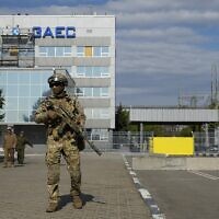 A Russian serviceman stands guard in an area of the Zaporizhzhia Nuclear Power Station in territory under Russian military control, southeastern Ukraine, May 1, 2022. (AP Photo)