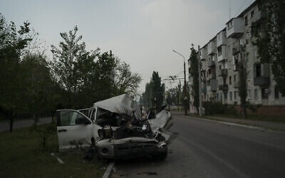 File: A heavily damaged car is seen on a street after a Russian attack in Severodonetsk, Luhansk region, Ukraine, Friday, May 13, 2022. (AP Photo/Leo Correa)