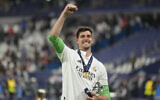 Real Madrid's goalkeeper Thibaut Courtois celebrates after winning the Champions League final soccer match between Liverpool and Real Madrid at the Stade de France in Saint Denis near Paris, May 29, 2022. (AP Photo/Kirsty Wigglesworth)