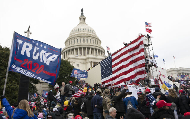 Violent insurrectionists loyal to then US president Donald Trump stand outside the US Capitol in Washington on Jan. 6, 2021. (AP Photo/Jose Luis Magana, File)