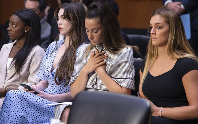 United States gymnasts from left, Simone Biles, McKayla Maroney, Aly Raisman and Maggie Nichols, arrive to testify during a Senate Judiciary hearing about the Inspector General's report on the FBI's handling of the Larry Nassar investigation on Capitol Hill, in Washington, Sept. 15, 2021. (Saul Loeb/Pool via AP, File)