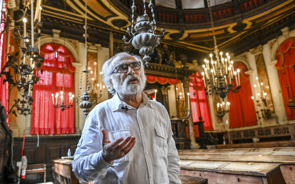 Dario Calimani, the president of the Jewish Community of Venice, poses inside the Spanish Schola Synagogue in Venice, northern Italy, June 1, 2022. The Spanish Schola, founded about 1580, but rebuilt in the first half of the 17th century, is the biggest of the Venetian synagogues. Venice’s Jewish ghetto is considered the first in Europe and one of the first in the world, and a new effort is underway to preserve its 16th century synagogues for the Jews who have remained and tourists who pass through. (AP Photo/Chris Warde-Jones)