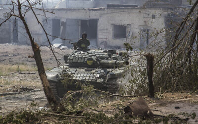 A Ukrainian tank is in position during heavy fighting on the front line in Severodonetsk, the Luhansk region, Ukraine, June 8, 2022. (AP Photo/Oleksandr Ratushniak)