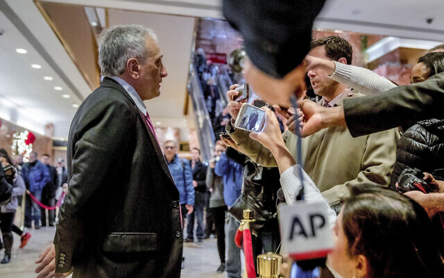 Carl Paladino, left, speaks to members of the media at Trump Tower, on Dec. 5, 2016, in New York. (AP Photo/Andrew Harnik, File)