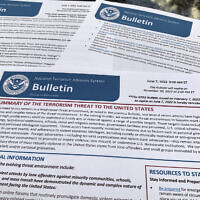 The bulletin issued by the Department of Homeland Security, outlining the current terrorism threat to the United States, is photographed Thursday, June 9, 2022. (AP Photo/Jon Elswick)