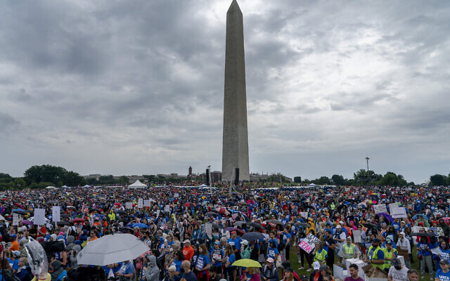 People participate in the second March for Our Lives rally in support of gun control in front of the Washington Monument, June 11, 2022, in Washington. (AP Photo/Gemunu Amarasinghe)