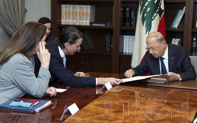 Lebanese President Michel Aoun, right, meets with US Envoy for Energy Affairs Amos Hochstein, center left, at the presidential palace, in Baabda, east of Beirut, Lebanon, June 14, 2022. (Dalati Nohra via AP)