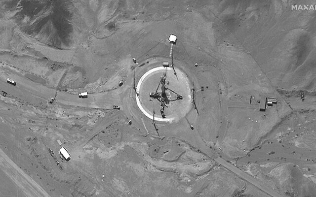 This satellite image from Maxar Technologies shows a rocket erected at a launch pad at Imam Khomeini Space Center in Iran on Tuesday, June 14, 2022. (Satellite image ©2022 Maxar Technologies via AP)
