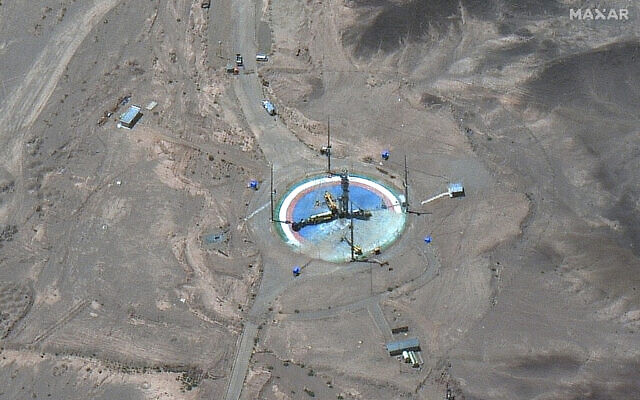 This satellite image from Maxar Technologies shows a rocket preparing to be erected at a launch pad at Imam Khomeini Space Center southeast of Semnan, Iran, on Tuesday, June 14, 2022. (Satellite image ©2022 Maxar Technologies via AP)
