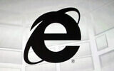 The Microsoft Internet Explorer logo is projected on a screen during a Microsoft Xbox E3 media briefing in Los Angeles, June 4, 2012 (AP Photo/Damian Dovarganes, File)