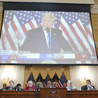 A video exhibit plays as the House select committee investigating the Jan. 6 attack on the US Capitol continues to reveal its findings of a year-long investigation, at the Capitol in Washington, Monday, June 13, 2022.  (AP Photo/Susan Walsh)
