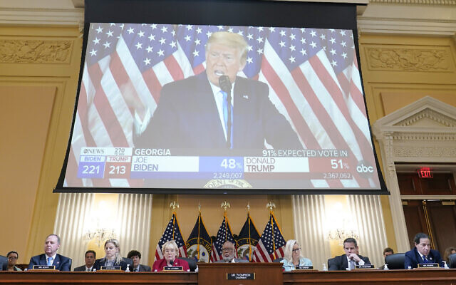 A video exhibit plays as the House select committee investigating the Jan. 6 attack on the US Capitol continues to reveal its findings of a year-long investigation, at the Capitol in Washington, Monday, June 13, 2022.  (AP Photo/Susan Walsh)