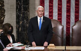 Vice President Mike Pence, returns to the House chamber after midnight, Jan. 7, 2021, to finish the work of the Electoral College after a mob loyal to President Donald Trump stormed the Capitol in Washington and disrupted the process. (AP Photo/J. Scott Applewhite, File)