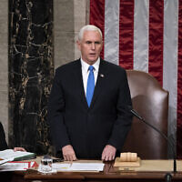 Vice President Mike Pence, returns to the House chamber after midnight, Jan. 7, 2021, to finish the work of the Electoral College after a mob loyal to President Donald Trump stormed the Capitol in Washington and disrupted the process. (AP Photo/J. Scott Applewhite, File)