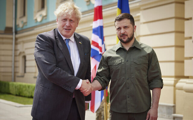 In this image provided by the Ukrainian Presidential Press Office, Ukrainian President Volodymyr Zelenskyy, right, and Britain's Prime Minister Boris Johnson, pose for a photo during their meeting in downtown Kyiv, Ukraine, June 17, 2022. (Ukrainian Presidential Press Office via AP)
