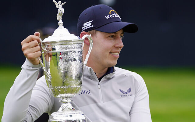 Matthew Fitzpatrick, of England, poses with the trophy after winning the US Open golf tournament at The Country Club, in Brookline, Mass., June 19, 2022. (Julio Cortez/AP)