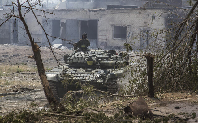 A Ukrainian tank is in position during heavy fighting on the front line in Severodonetsk, the Luhansk region, Ukraine, June 8, 2022. (AP Photo/Oleksandr Ratushniak)