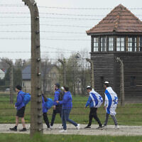 Illustrative: Jewish people visit the Auschwitz Nazi concentration camp after the March of the Living annual observance, in Oswiecim, Poland, April 28, 2022. (AP Photo/Czarek Sokolowski, File)
