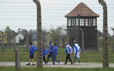 Illustrative: Jewish people visit the Auschwitz Nazi concentration camp after the March of the Living annual observance, in Oswiecim, Poland, April 28, 2022. (AP Photo/Czarek Sokolowski)