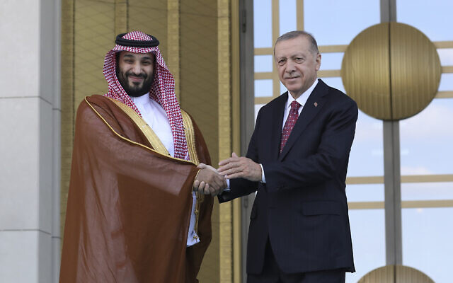 Turkish President Recep Tayyip Erdogan, right, and Saudi Crown Prince Mohammed bin Salman shake hands during a welcome ceremony, in Ankara, Turkey, Wednesday, June 22, 2022.  (AP Photo/Burhan Ozbilici)