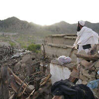 A man stands among destruction after an earthquake in Gayan village, Afghanistan, June 23, 2022. (AP Photo/Ebrahim Nooroozi)