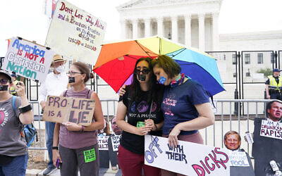 Abortion-rights activists react outside the Supreme Court in Washington, June 24, 2022. (AP Photo/Jacquelyn Martin)